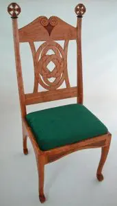 Celtic cross spinning chair green upholstery