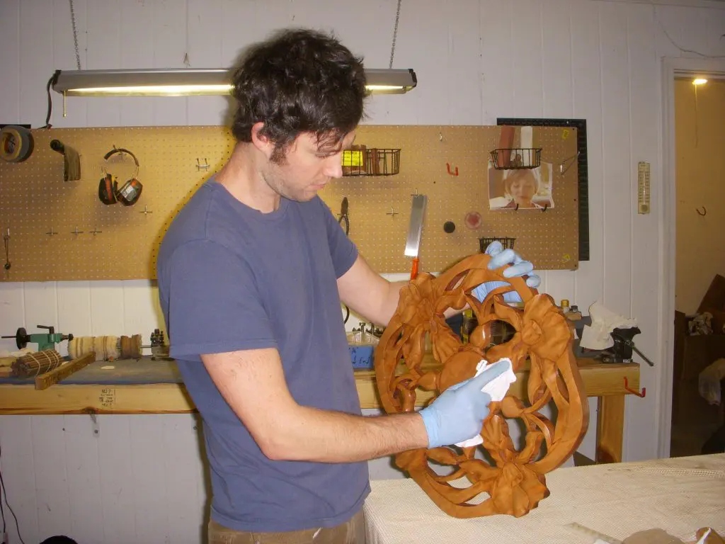 Obe in his new shop in Athens, Georgia (applying finish to an Iris Wheel) 