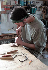 Man carving in workshop