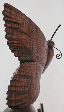 Walnut triple flyer butterfly and irises spinning wheel figurehead side view