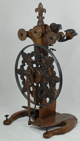 Fleur de lys spinning wheel triple flyer operator view